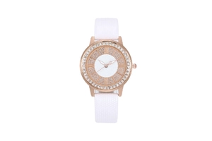 Detail of rose gold watch with diamond bezel, Roman numerals and white leather strap