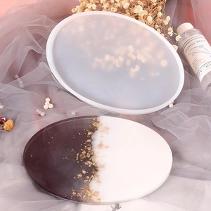 Oval silicone resin mold for DIY jewelry tray with black and white gold foil tray sample