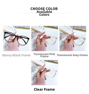 Detail view of blue light glasses frames in bright black, transparent pink, grey, and clear