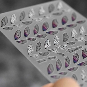 Macro detail of 5D Tomoni nail art stickers showing intricate purple butterfly wing patterns