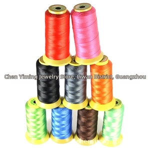 Macro shot of colorful high-strength polyester threads on spools for DIY sewing and crafting
