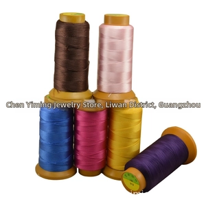 Macro shot of 6-color 4-ply polyester threads for jewelry making and bead weaving