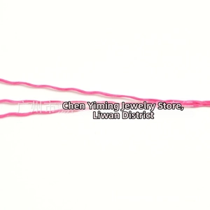 Close-up of three pink wave-patterned polyester threads for jewelry making and DIY crafts