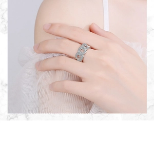 Detail of silver chain ring with micro-pave crystals worn by a model on finger