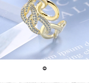 Close-up of a gold micro-pave chain link ring with sparkling rhinestones for women