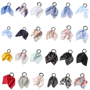 24-piece set of floral and polka dot elastic hair scrunchies with various colorful patterns