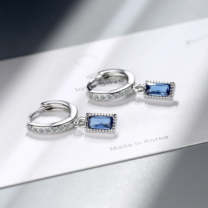 Elegant silver earrings with sparkling zircon pave and rectangular blue stone drops