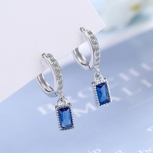 Elegant silver drop earrings featuring blue rectangular crystals and white zircon stones