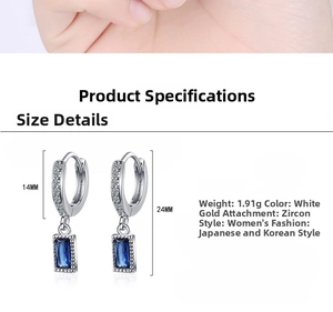 Detailed view of silver-tone hoop earrings with blue zircon rectangle pendant and 24mm length