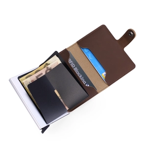 Detail of RFID blocking brown leather wallet with aluminum automatic pop-up card mechanism