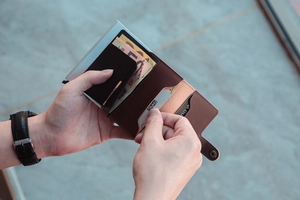 Brown PU leather wallet detail showing the functional interior layout and banknote compartment