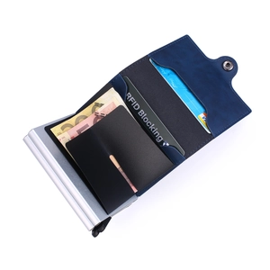 Detail view of blue leather RFID blocking wallet with aluminum card pop-up and cash slot