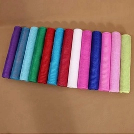 Top view of fourteen colorful mesh ribbon rolls for flower and gift packaging