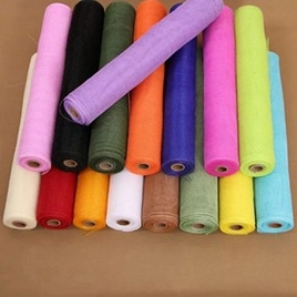 Colorful rolls of mesh fabric for gift wrapping and floral decoration in various shades