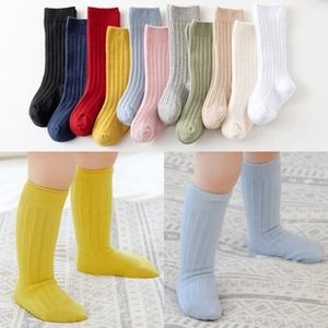 Detailed view of ribbed knit baby knee high socks in various colorful assortments