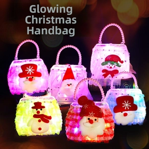 Luminous Christmas handbag with Santa and snowman motifs featuring white pearl handles