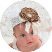 Detail of Christmas reindeer antler baby headband with brown flower and white lace