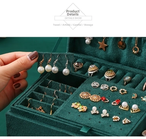 Detailed internal view of velvet jewelry box with earring plate and ring storage slots