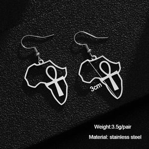 Macro detail of stainless steel Africa map earrings with Ankh symbol and 3cm size spec