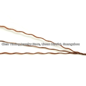 Macro detail of wavy brown synthetic fiber thread for DIY jewelry and beaded crafts