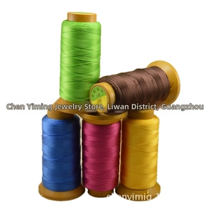 Macro detail of multi-colored 15-ply polyester threads for jewelry making and DIY crafts