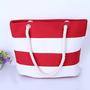 Minimalist red and white striped canvas tote bag with thick rope handles on white background
