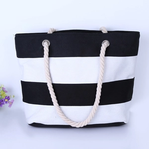 Striped canvas tote bag with thick rope handles on a clean white background