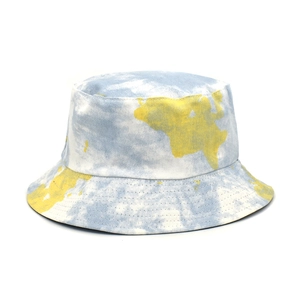 Detail of tie-dye bucket hat featuring yellow world map print and reinforced brim stitching