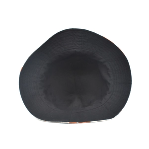 Close-up of the interior stitching and textured fabric of this black reversible bucket hat