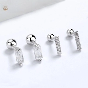 Macro detail of 925 sterling silver square zircon and pavé bar screw back earrings