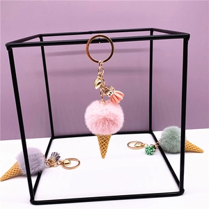 Cute plush ice cream cone keychain with colorful fur balls and golden metal ring