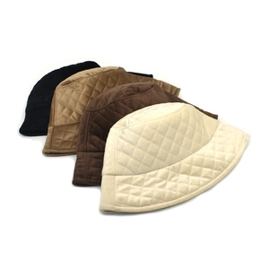 Quilted checkered bucket hat in black camel and beige colors for winter outdoor warmth