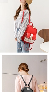 Detail of stylish PU leather backpack with gold chains in red and black colors