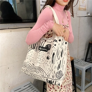 Artistic canvas tote bag with abstract black lines for daily commute and casual use