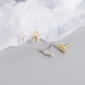 Macro shot of S925 sterling silver wing earrings with marquise-cut marquise-cut stones