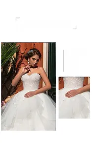 Detail of elegant off-shoulder bridal gown featuring exquisite lace floral embroidery and tulle