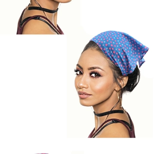 Blue headscarf with pink stars pattern shown on a model for beach or outdoor style