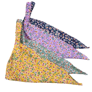 Detailed set of four floral triangle headbands in yellow, green, purple, and navy blue