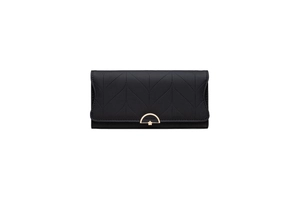 Detail of black quilted PU leather wallet featuring a floral golden metal buckle