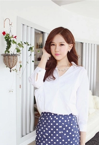 Elegant white long sleeve shirt paired with high waist navy blue polka dot midi skirt