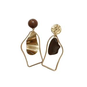 Asymmetric gold and brown geometric drop earrings with irregular metal and resin elements