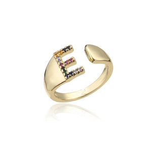 Detail of 18K gold letter E ring featuring colorful micro-set gems on white background