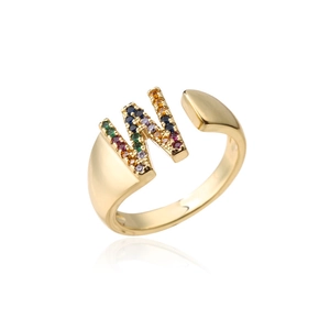 Macro shot of 18K gold letter W open ring featuring colorful micro-pave cubic zirconia