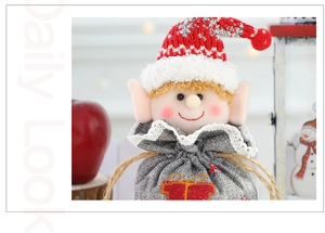 Detailed view of Christmas elf gift bag with knitted hat and festive embroidery