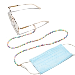 Detail of colorful heishi bead chain with metal clips and rubber loops for glasses
