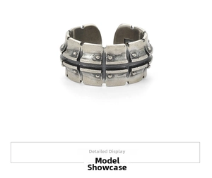 Detail view of adjustable punk motorcycle track ring with rivets and vintage silver finish