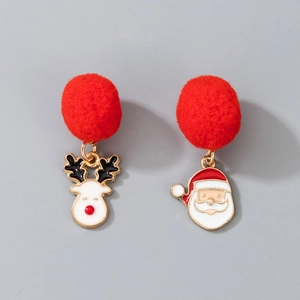Close-up of festive Christmas earrings featuring red pom-poms with reindeer and Santa charms