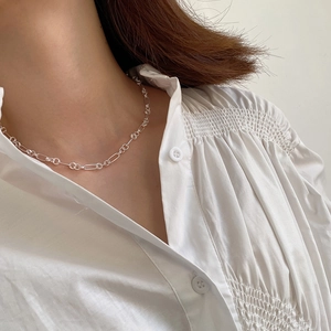 Elegant 925 sterling silver circle chain necklace worn by model on white shirt