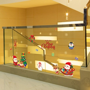Vibrant Santa and reindeer Christmas window stickers applied to staircase glass