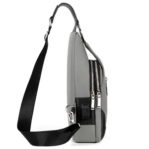 Sleek gray men's crossbody chest bag with USB charging port and durable oxford fabric